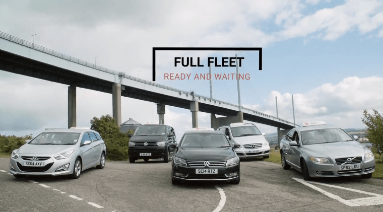 Inverness Taxis fleet beneath Kessock Bridge with a Full Fleet Ready and Waiting message