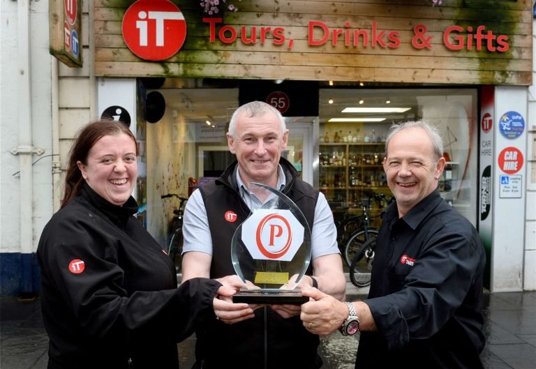 Inverness Taxi celebrating with award